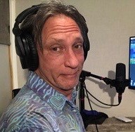 Randy Landenberger in his studio with headset and microphone